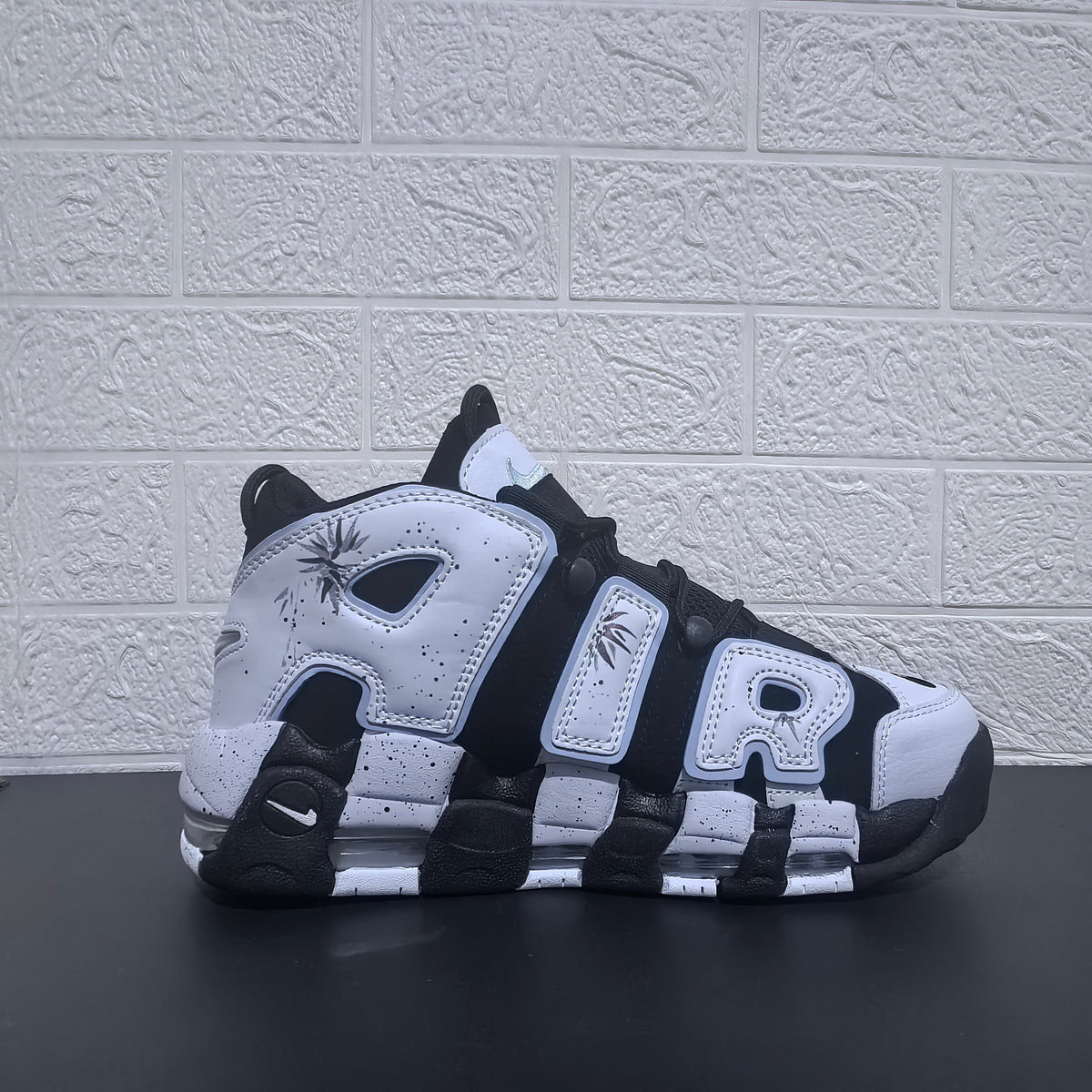 Nike Air More Uptempo Panda Sneakers in Black and White - product image from the listing.
