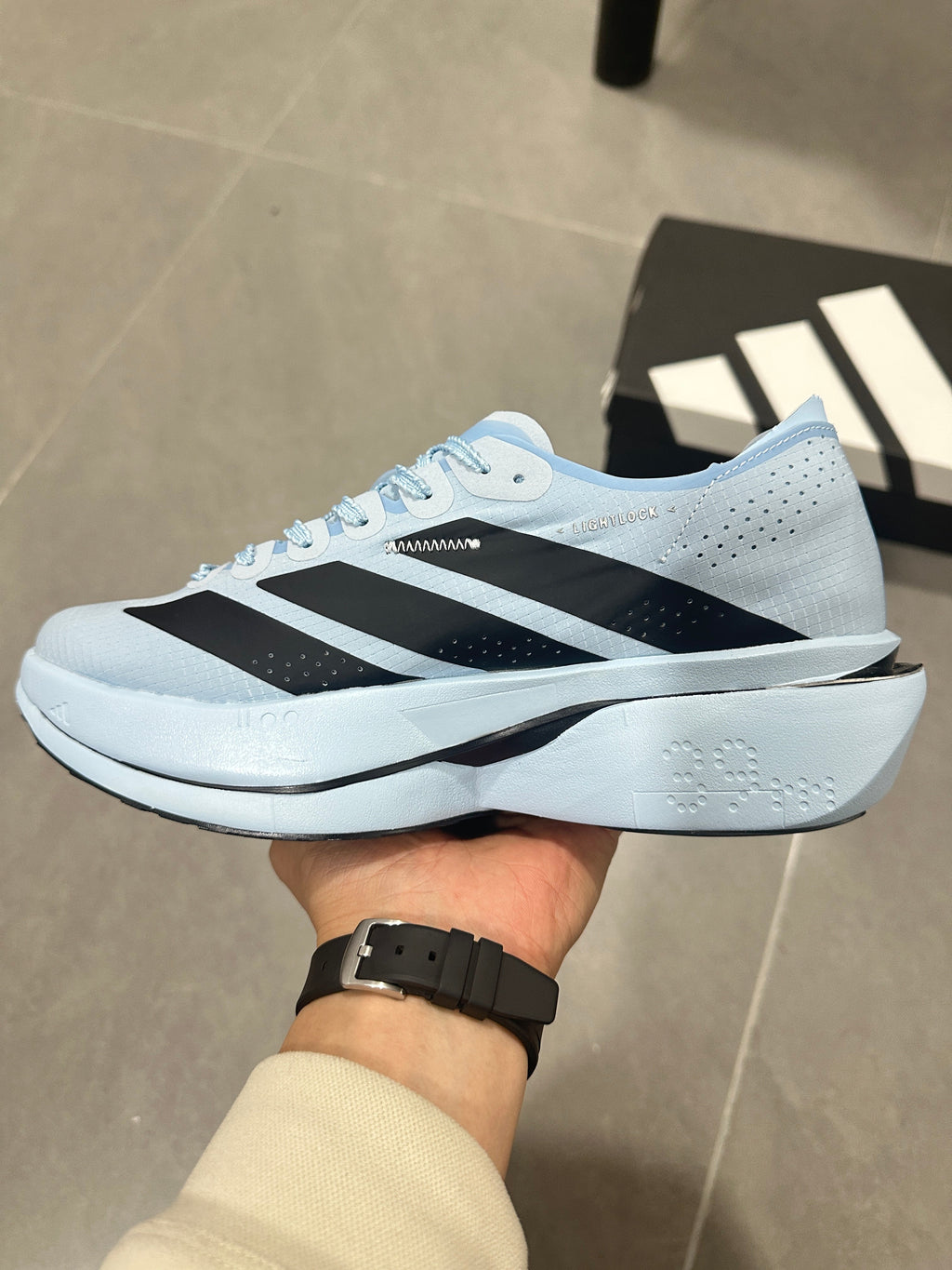 adidas Adizero Adios Pro Running Shoes, in Light Blue and Black - product image from the listing.