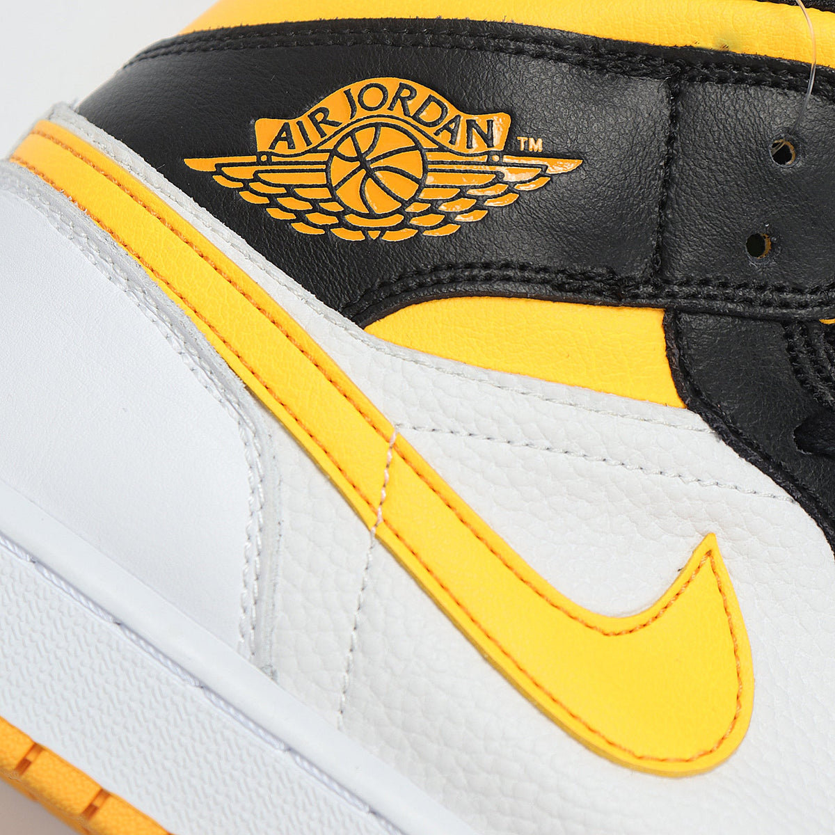 Jordan 1 High Sneakers in Black Yellow White CV5276-107 - product image from the listing.