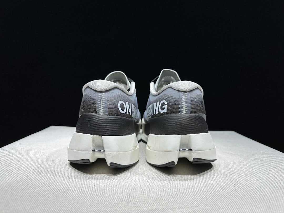 On Cloudboom Max Running Shoes, in White and Black - product image from the listing.