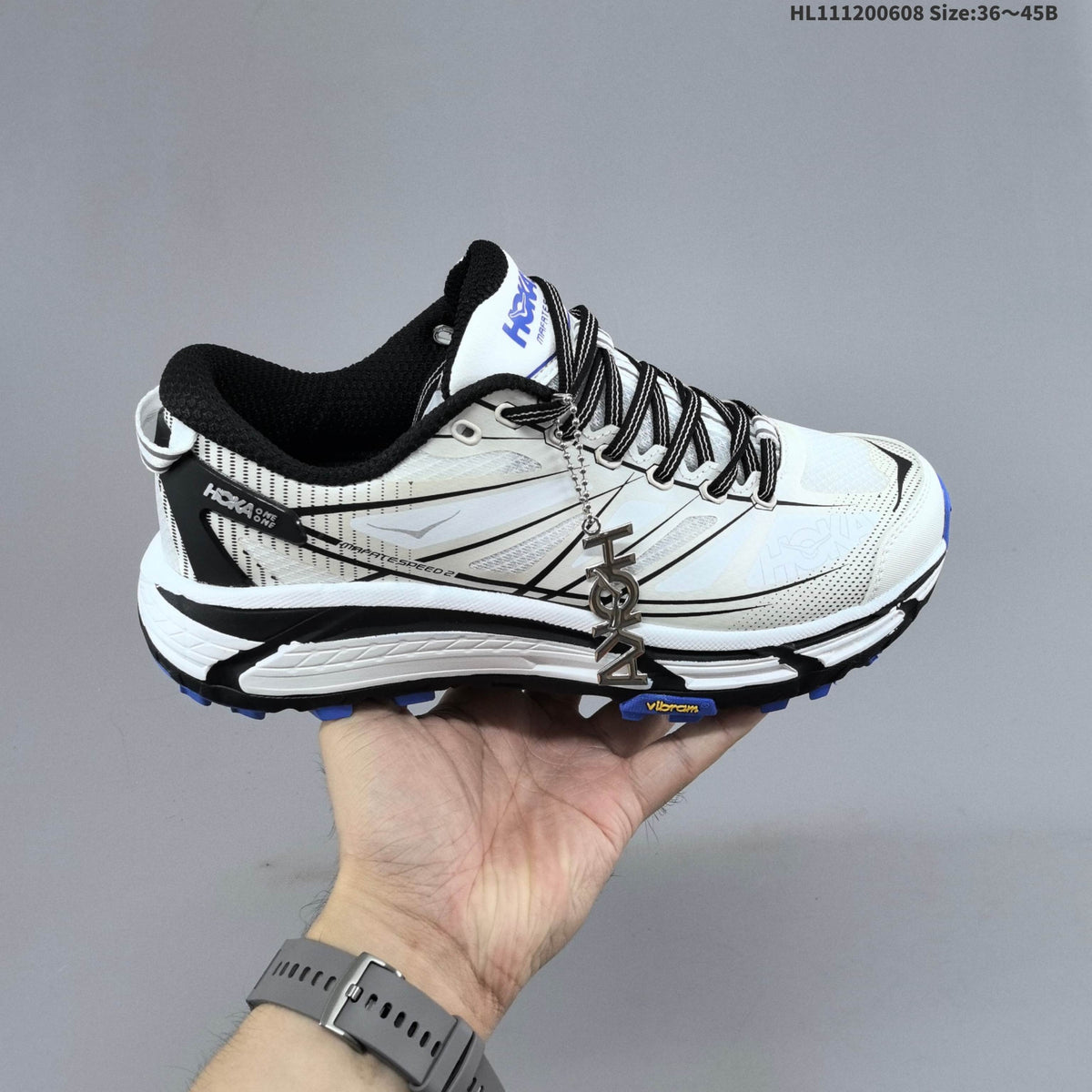HOKA Mafate Speed 2 Low Trail Running Shoes, in White Black Blue - product image from the listing.