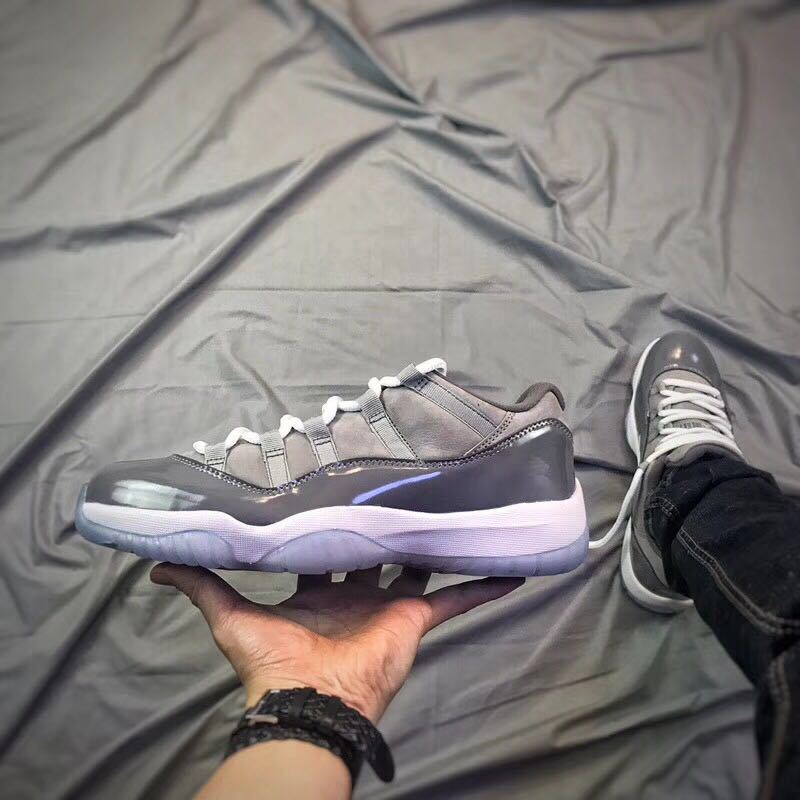 Air Jordan 11 Low Sneakers in Cool Grey - product image from the listing.