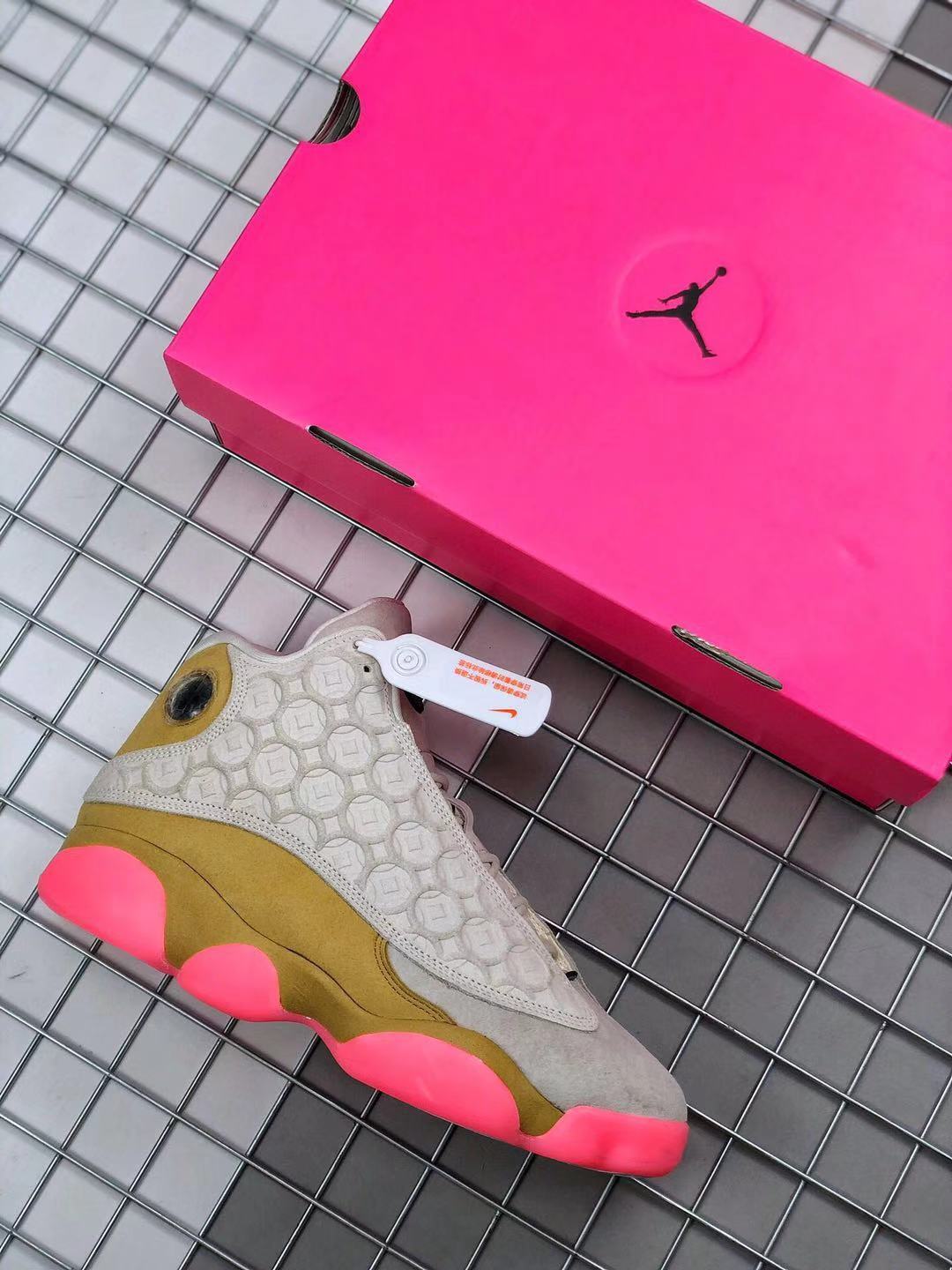 Air Jordan 13 CNY Sneakers in White, in Gold and Pink - product image from the listing.