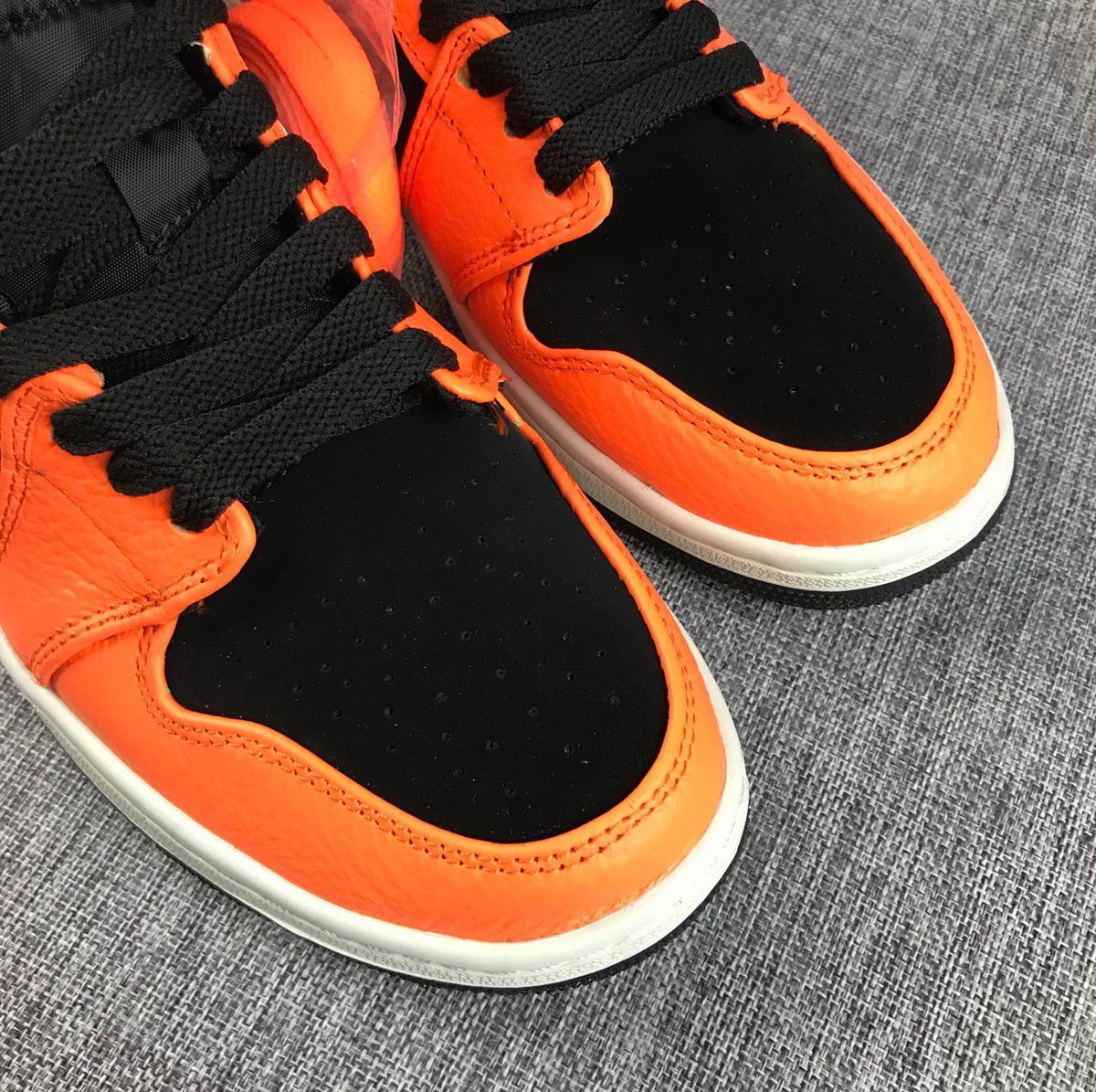Air Jordan 1 Mid Shattered Backboard Sneakers, in Black and Orange - product image from the listing.