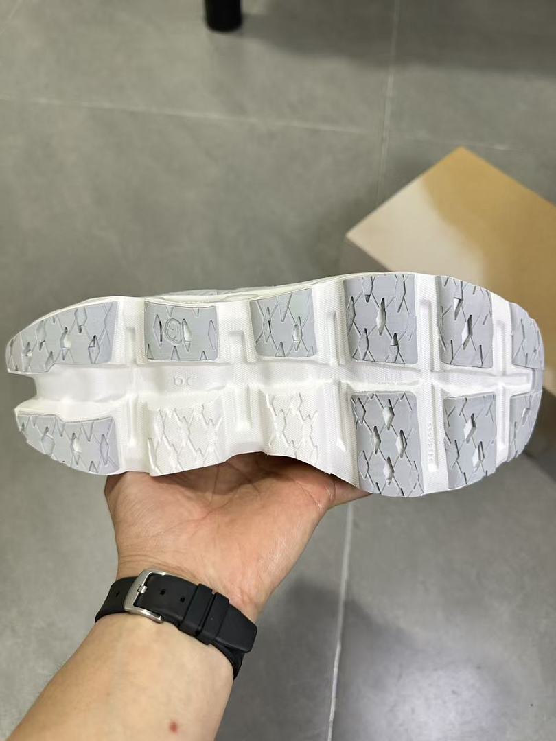 On Running Running Sneakers in White and Gray - product image from the listing.