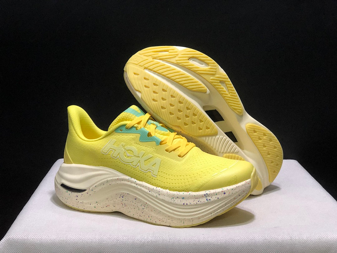 Yellow and Aqua HOKA Skyward X Running Shoes - product image from the listing.