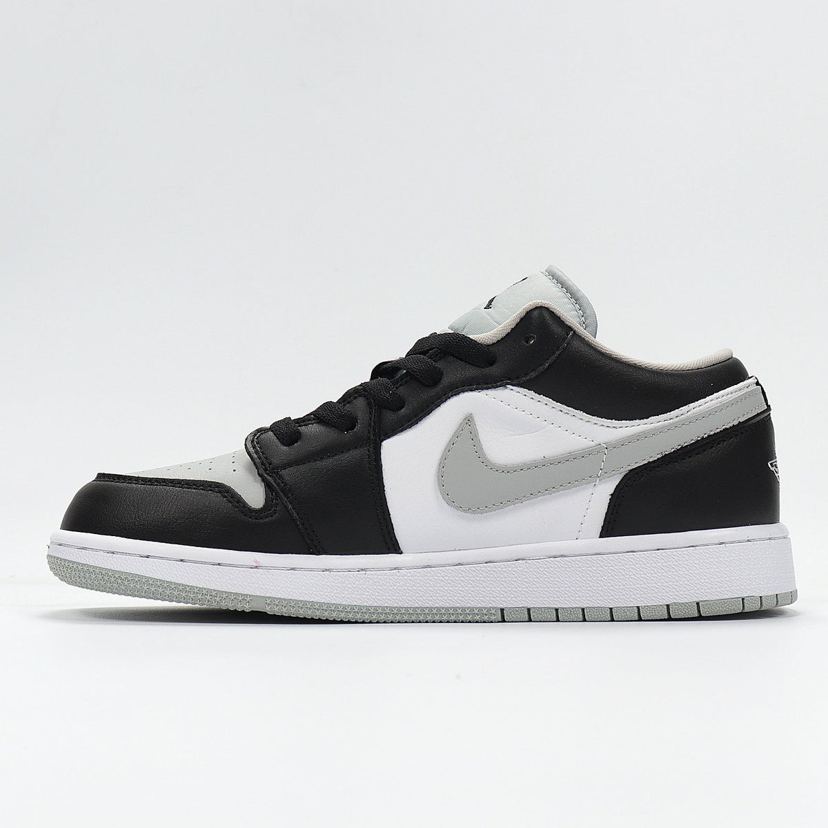 Jordan 1 Low Sneakers in Cool Grey 553560-039 - product image from the listing.