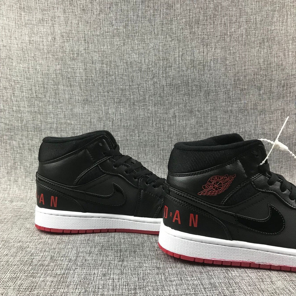 Air Jordan 1 Mid High-Top Sneakers in Black Red White - product image from the listing.