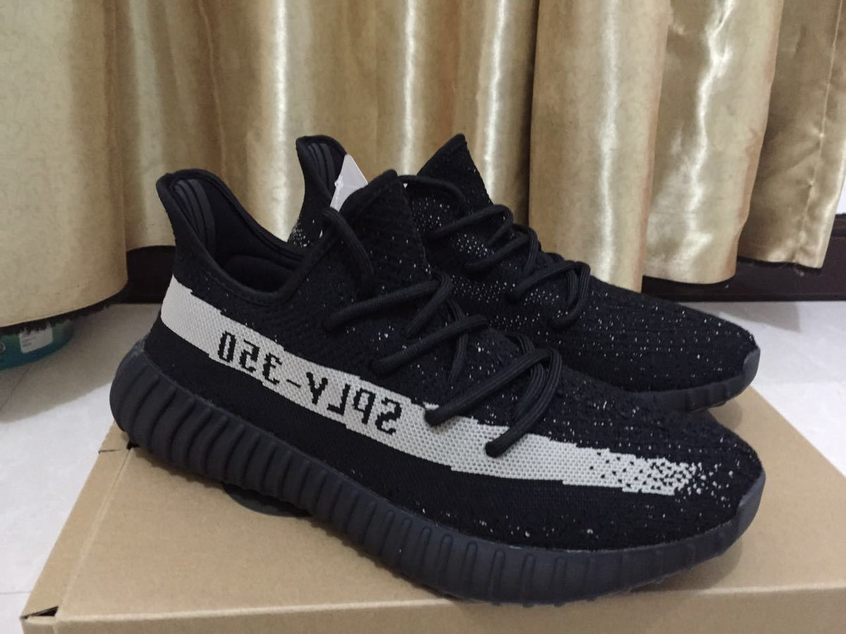 Adidas Yeezy Boost 350 V2 Sneakers in Black White - product image from the listing.
