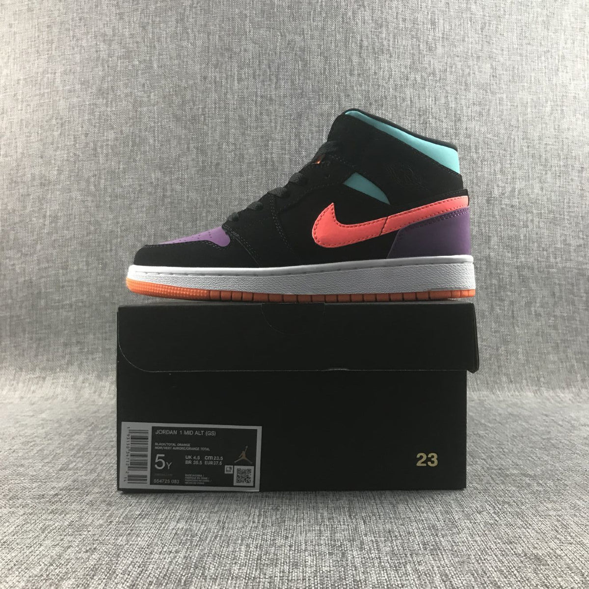 Jordan 1 Mid Sneakers in Multicolor Black 554725-083 - product image from the listing.