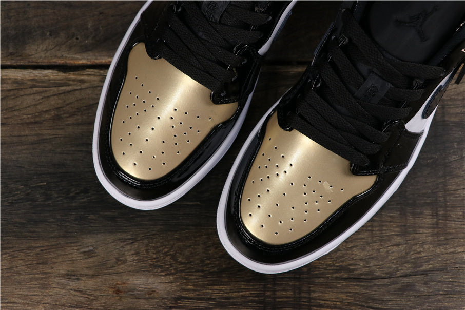Jordan 1 Low Sneakers in Black Gold CQ9447-700 - product image from the listing.