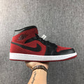 Air Jordan 1 Mid Sneakers in Red, in Black and White - product image from the listing.