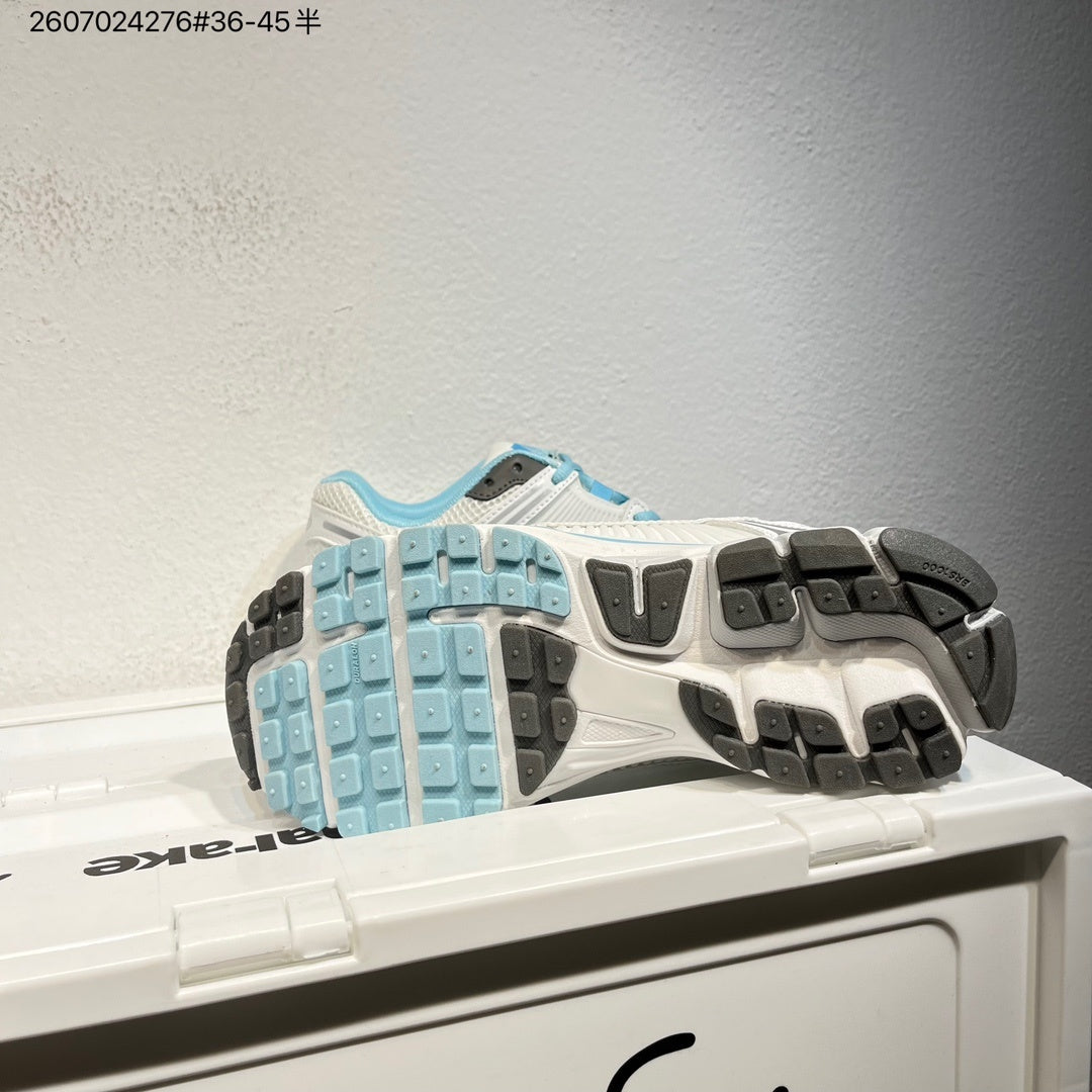 Nike Air Zoom Vomero 5 Sneakers in White and Blue - product image from the listing.
