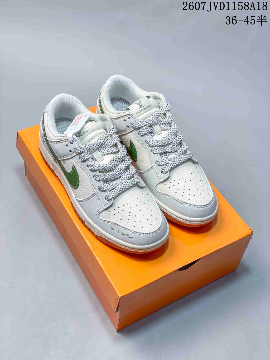 Nike SB Dunk Low Sneakers in White Green Gum 2607JVD1158A18 - product image from the listing.