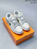 Nike SB Dunk Low Sneakers in White Green Gum 2607JVD1158A18 - product image from the listing.