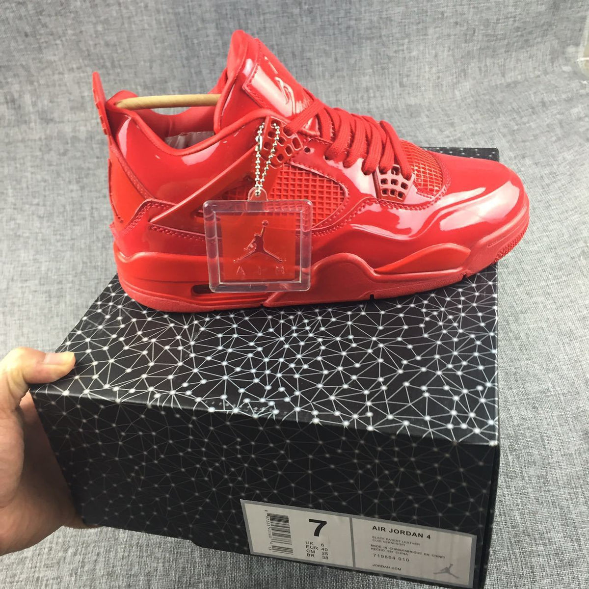 Air Jordan 4 Red Patent Leather Sneakers - product image from the listing.