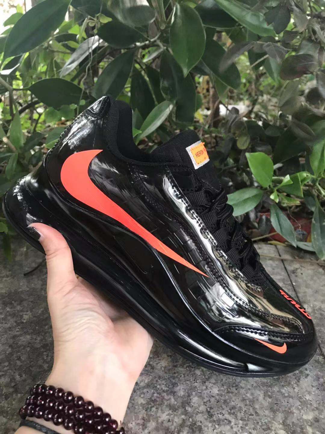Nike Air Max 720 Sneakers in Black and Bright Orange - product image from the listing.