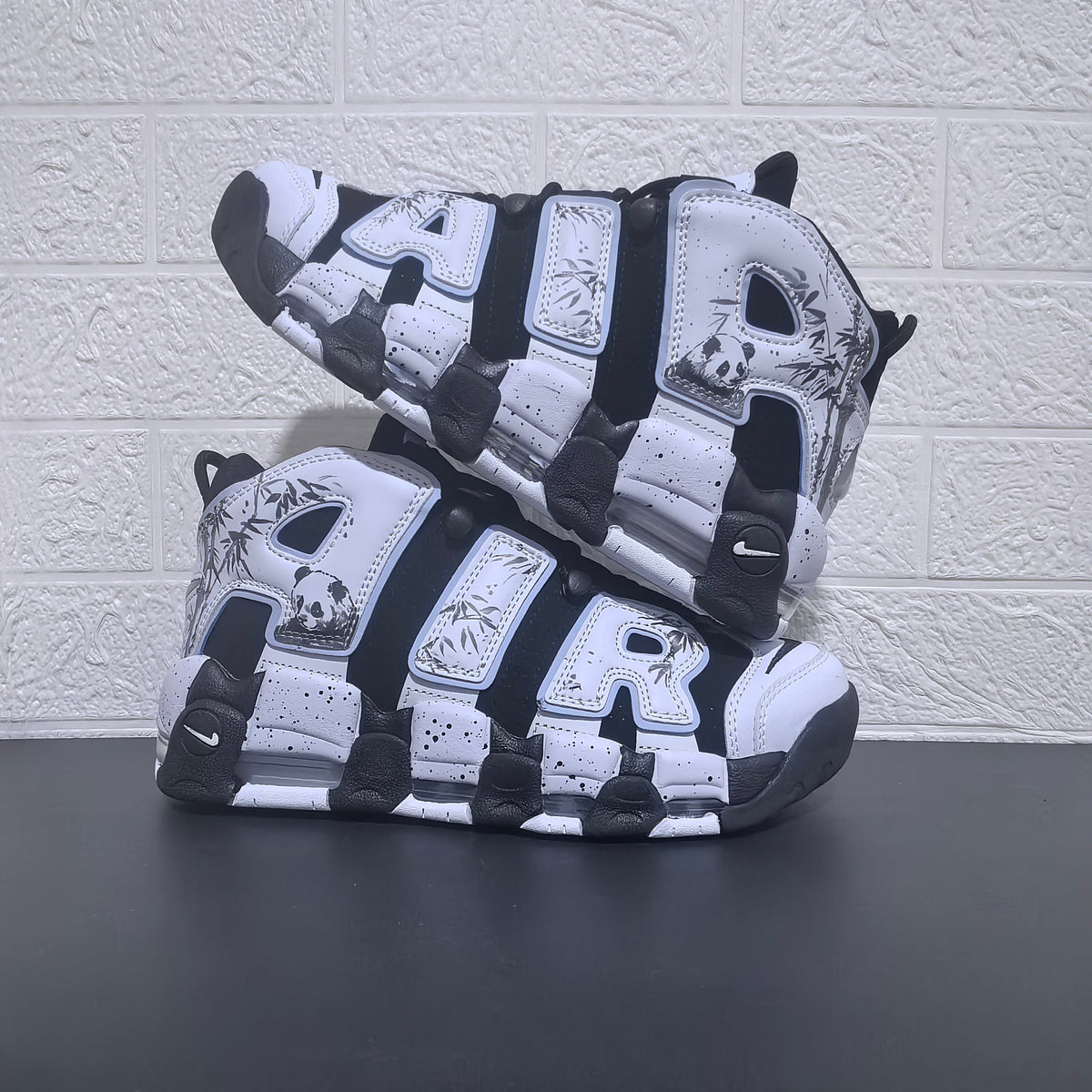 Nike Air More Uptempo Panda Sneakers in Black and White - product image from the listing.
