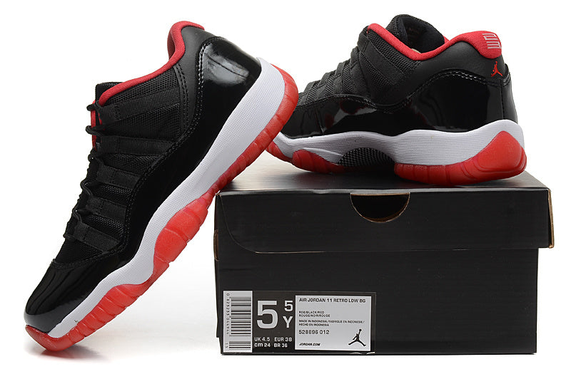 Air Jordan 11 Retro Low Black Red Sneakers - product image from the listing.