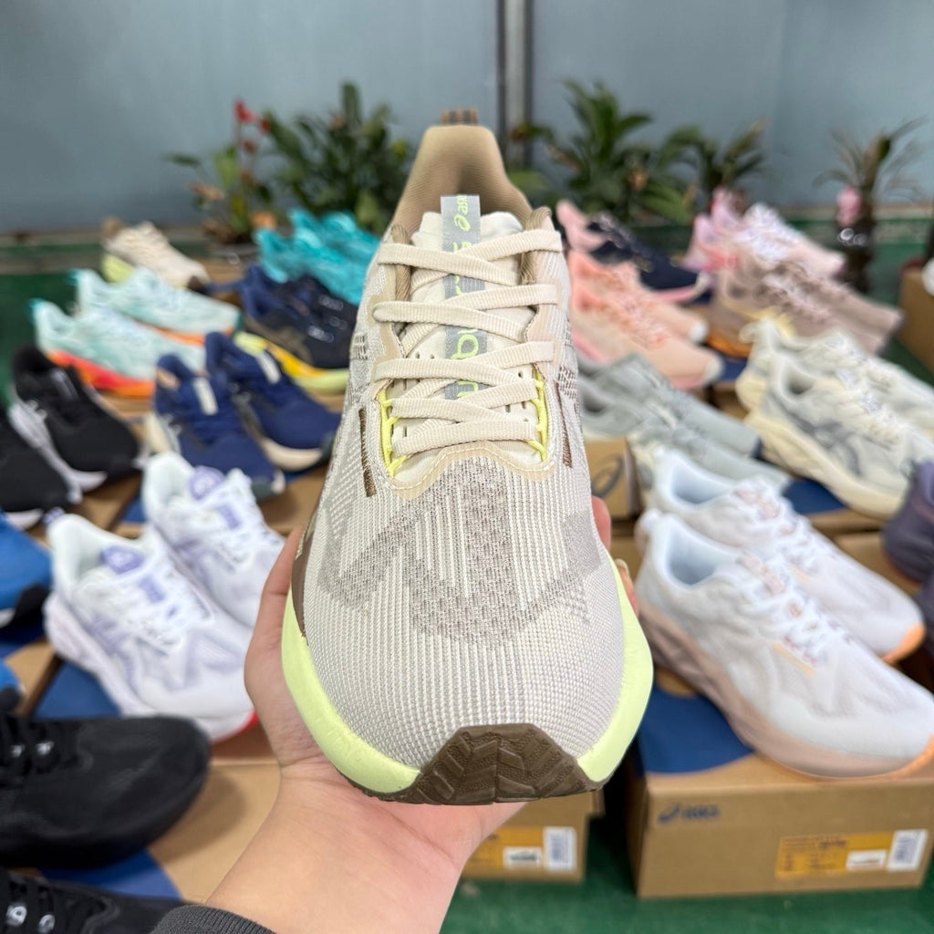 ASICS NOVABLAST 5 LE Running Shoes in Beige Grey Brown - product image from the listing.