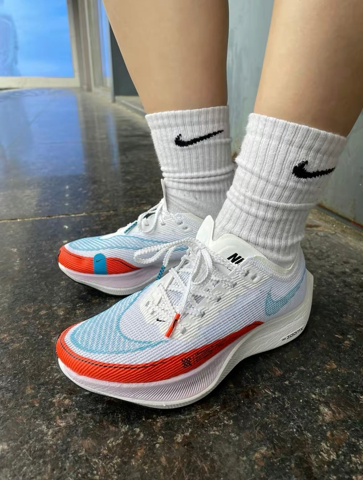 Nike ZoomX Vaporfly NEXT% 2 Running Shoes in White Blue Red CU4123-102 - product image from the listing.