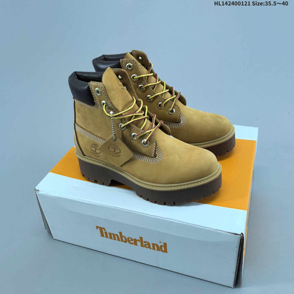 Mid-Top Lace-Up Boots in Wheat by Timberland - product image from the listing.
