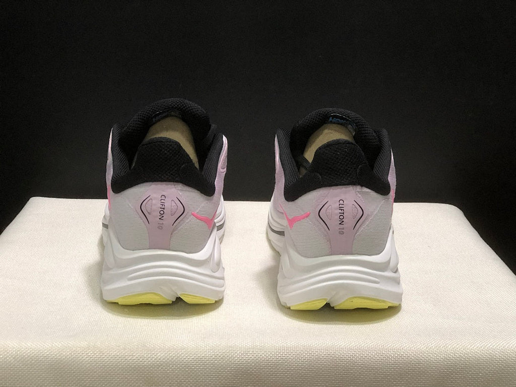 Pink and White HOKA Clifton 10 Running Shoes - product image from the listing.