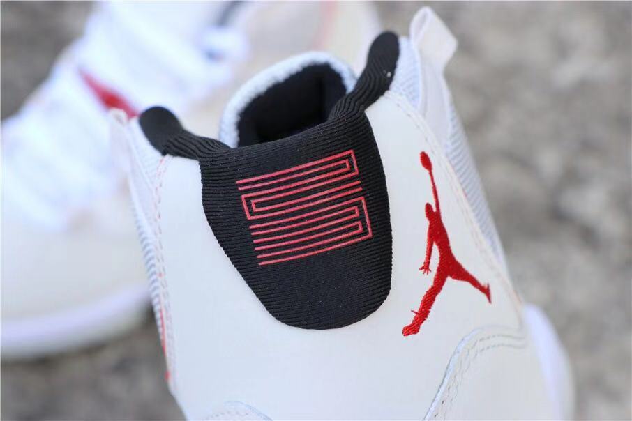 Air Jordan 11 Platinum Tint White High-Top Sneakers - product image from the listing.