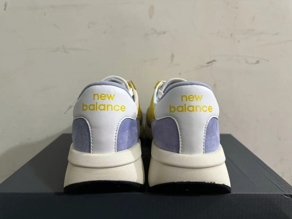 New Balance U370 Trainers in Yellow and Lavender - product image from the listing.