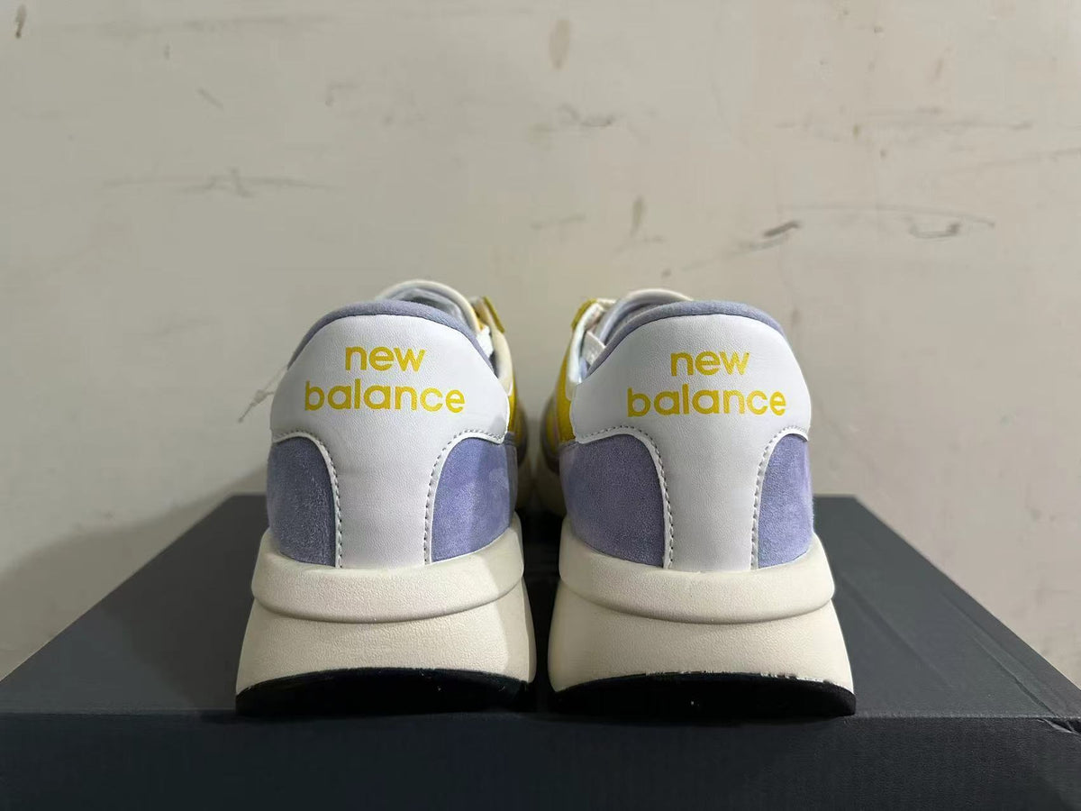 New Balance U370 Trainers in Yellow and Lavender - product image from the listing.