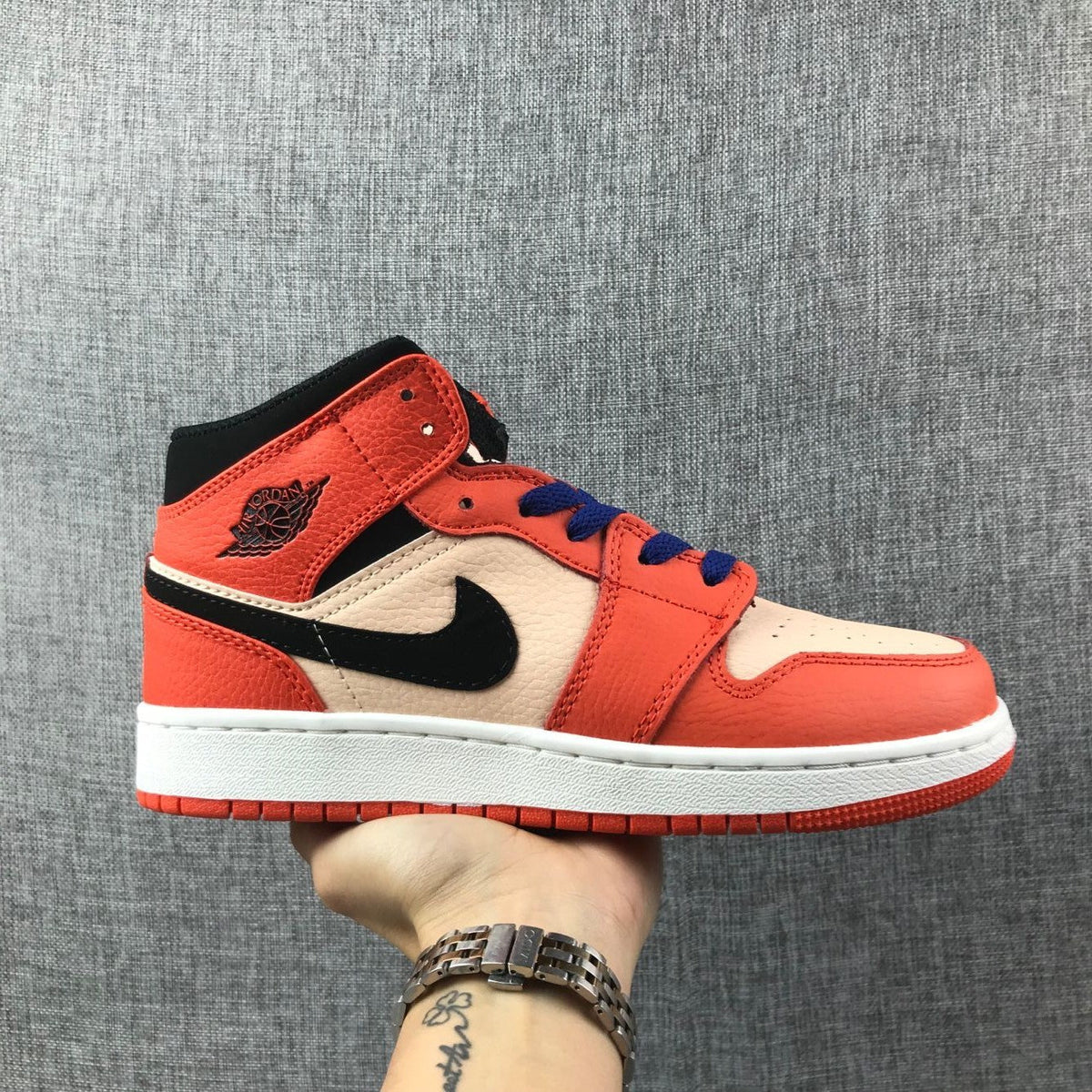 Air Jordan 1 Mid GS Sneakers in Pink and Orange - product image from the listing.