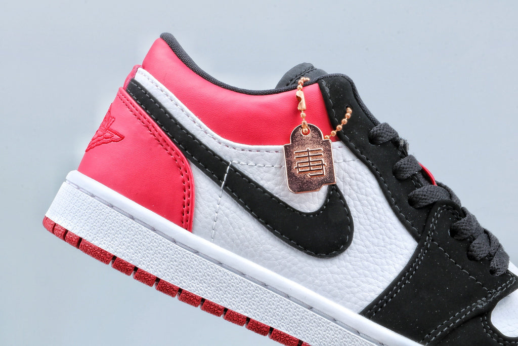 Jordan 1 Low Black Toe Sneakers in Black White Red - product image from the listing.