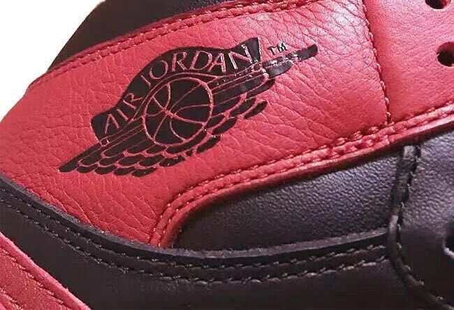 Air Jordan 1 High Sneakers in Black and Red - product image from the listing.