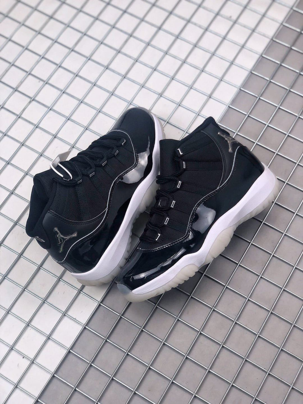 Air Jordan 11 Silver Eyelets Black White Sneakers - product image from the listing.