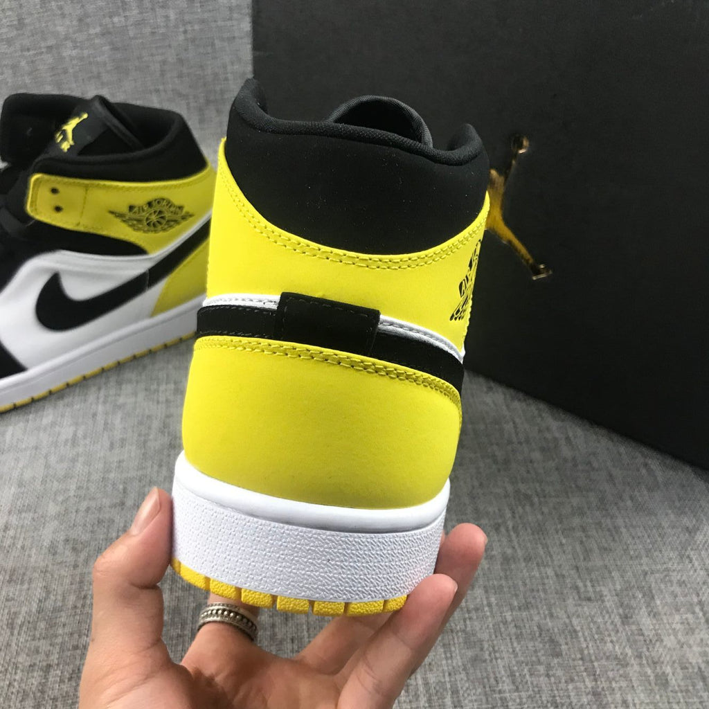 Black Yellow Toe Sneakers - Air Jordan 1 Mid SE 852542-071 - product image from the listing.
