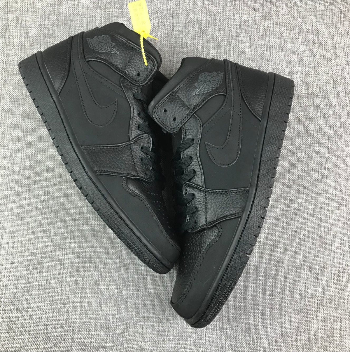 Air Jordan 1 Mid Sneakers, in Black - product image from the listing.