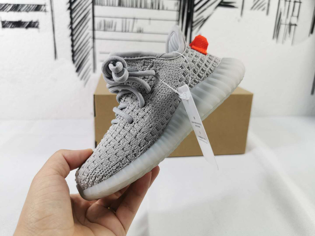 Light Grey and Coral Yeezy 350 V2 Kids Sneakers - product image from the listing.
