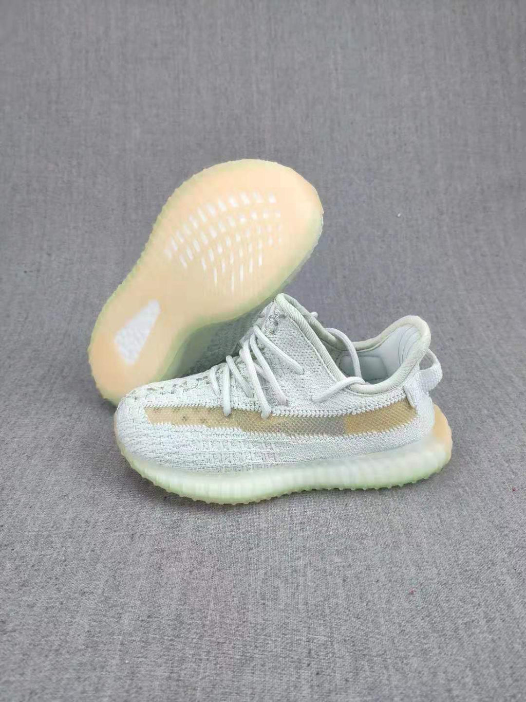 Yeezy Boost 350 V2 Kids Sneakers, in Light Neutral - product image from the listing.