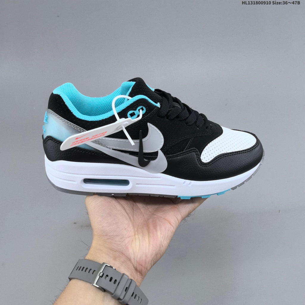 Nike Air Max 1 Sneakers in Black White and Turquoise - product image from the listing.