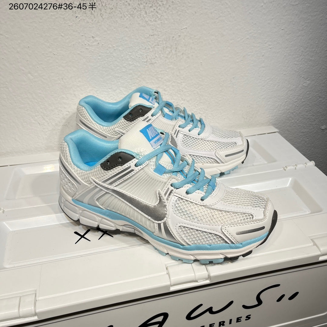 Nike Air Zoom Vomero 5 Sneakers in White and Blue - product image from the listing.
