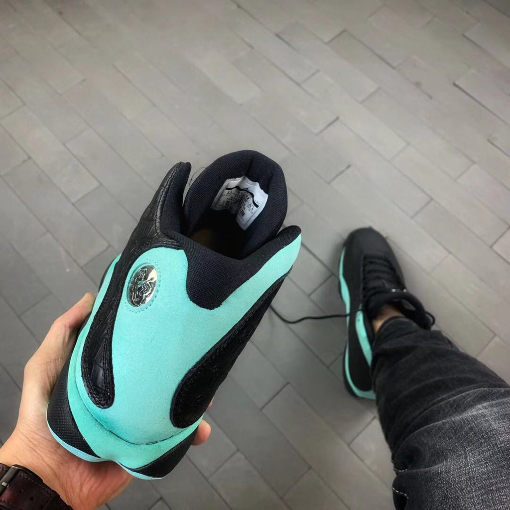 Air Jordan 13 Island Green Sneakers in Black Turquoise - product image from the listing.