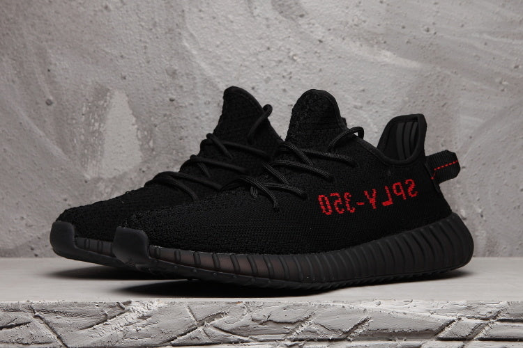 Yeezy Boost 350 V2 Black Knit Trainers with Red Accents - product image from the listing.