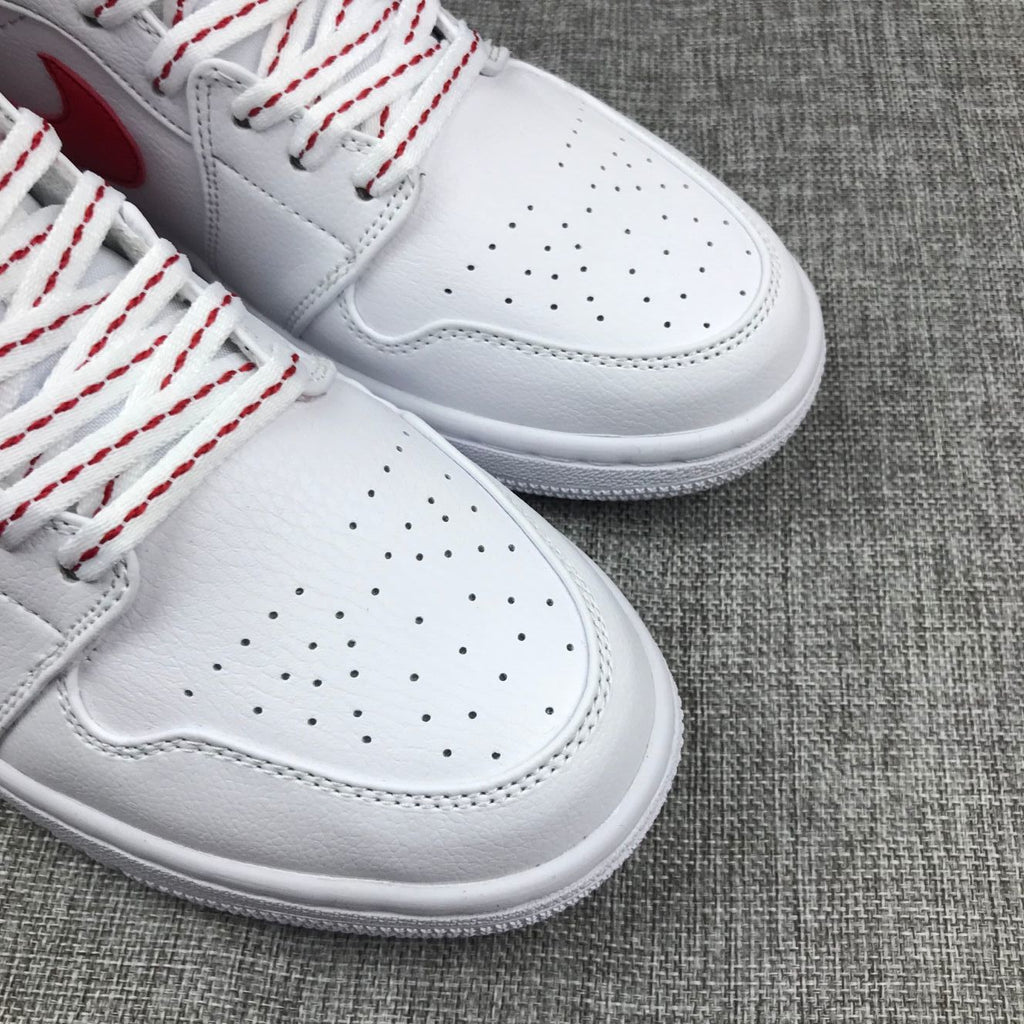 Air Jordan 1 Mid Sneakers in Ice Blue White and Red 555112-104 - product image from the listing.