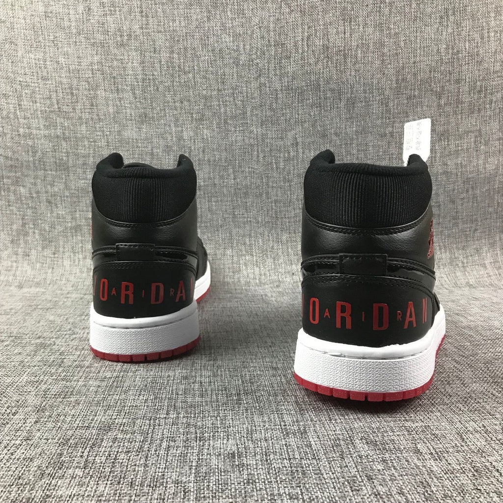 Air Jordan 1 Mid High-Top Sneakers in Black Red White - product image from the listing.