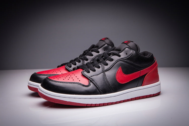 Jordan 1 Low Sneakers in Black and Red - product image from the listing.
