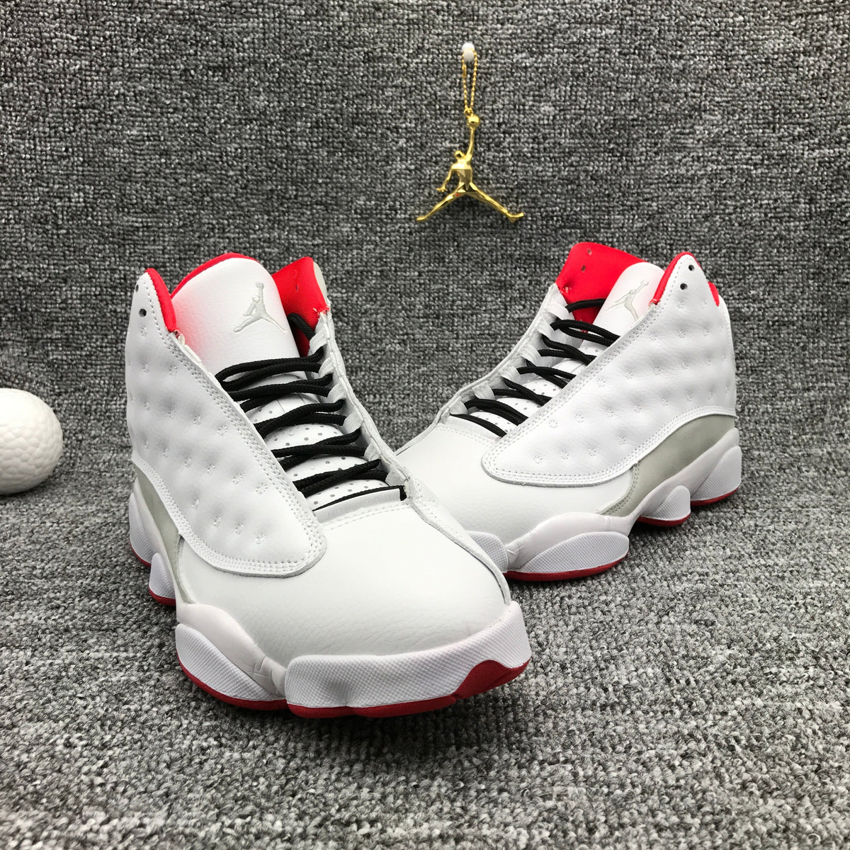 Air Jordan 13 High-Top Sneakers in White and Red - product image from the listing.