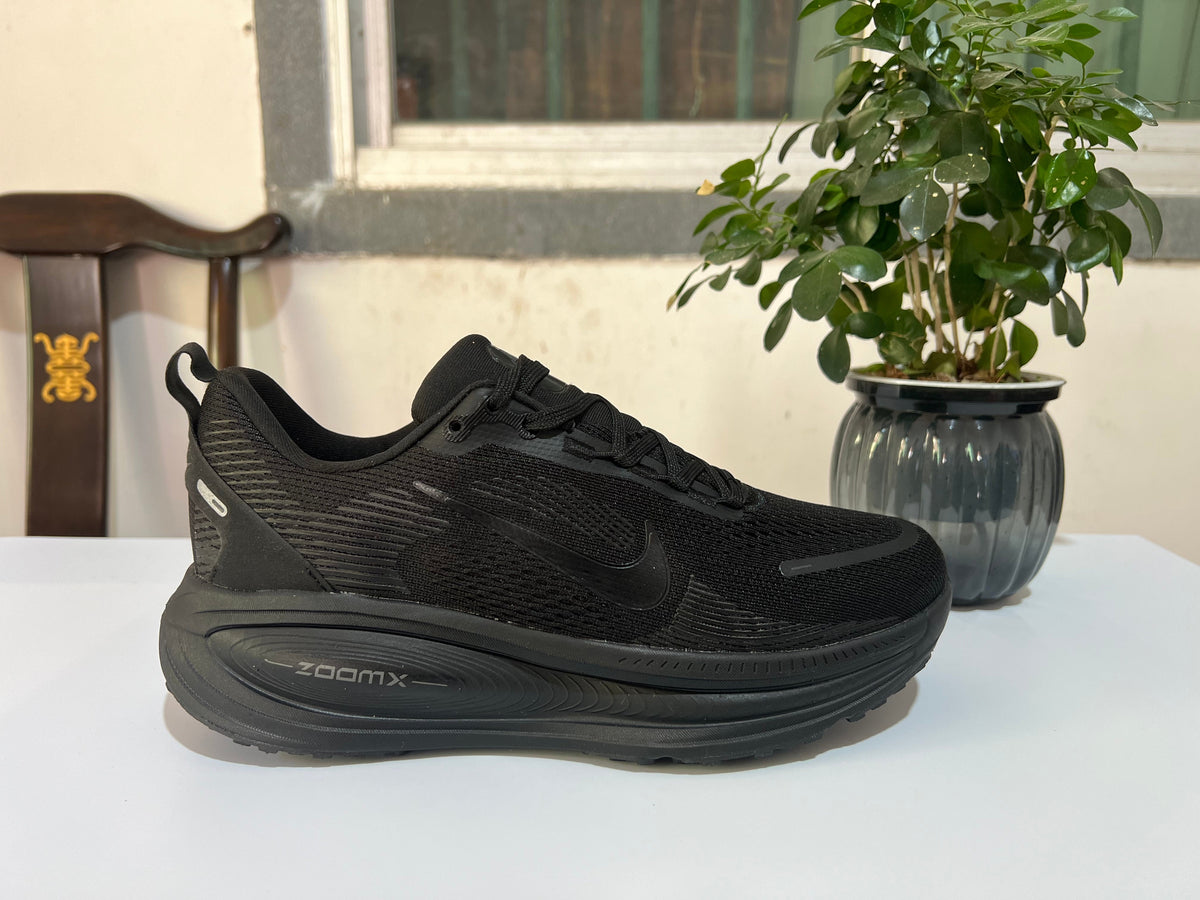 Nike Vomero 18 Running Shoes, in Black and Dark Gray - product image from the listing.