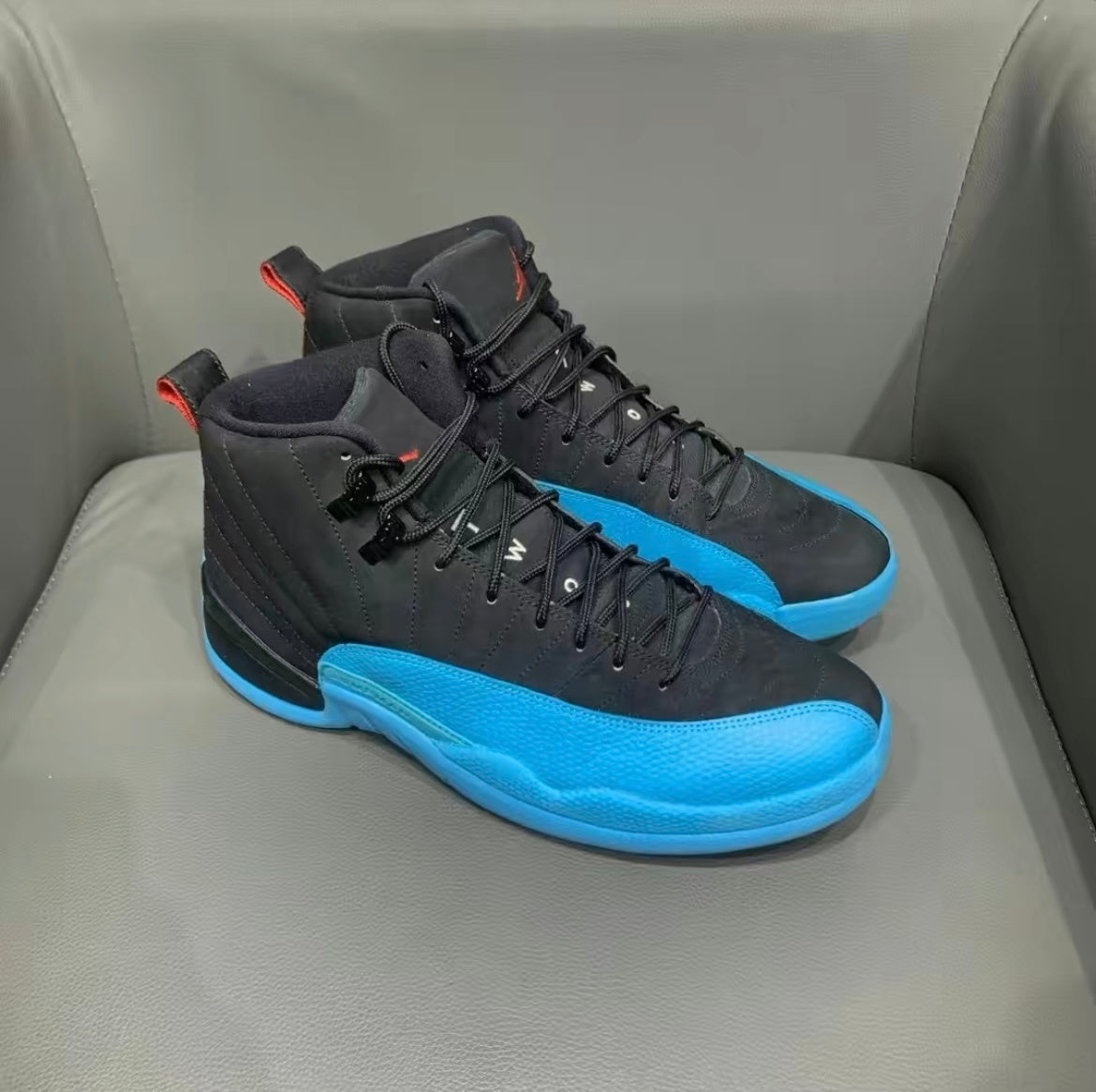 Air Jordan 12 Retro Gamma High-Top Sneakers in Blue 130690-027 - product image from the listing.