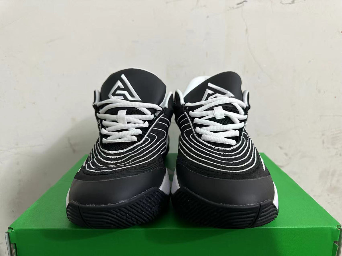 Nike Basketball Sneakers in Black and White - product image from the listing.