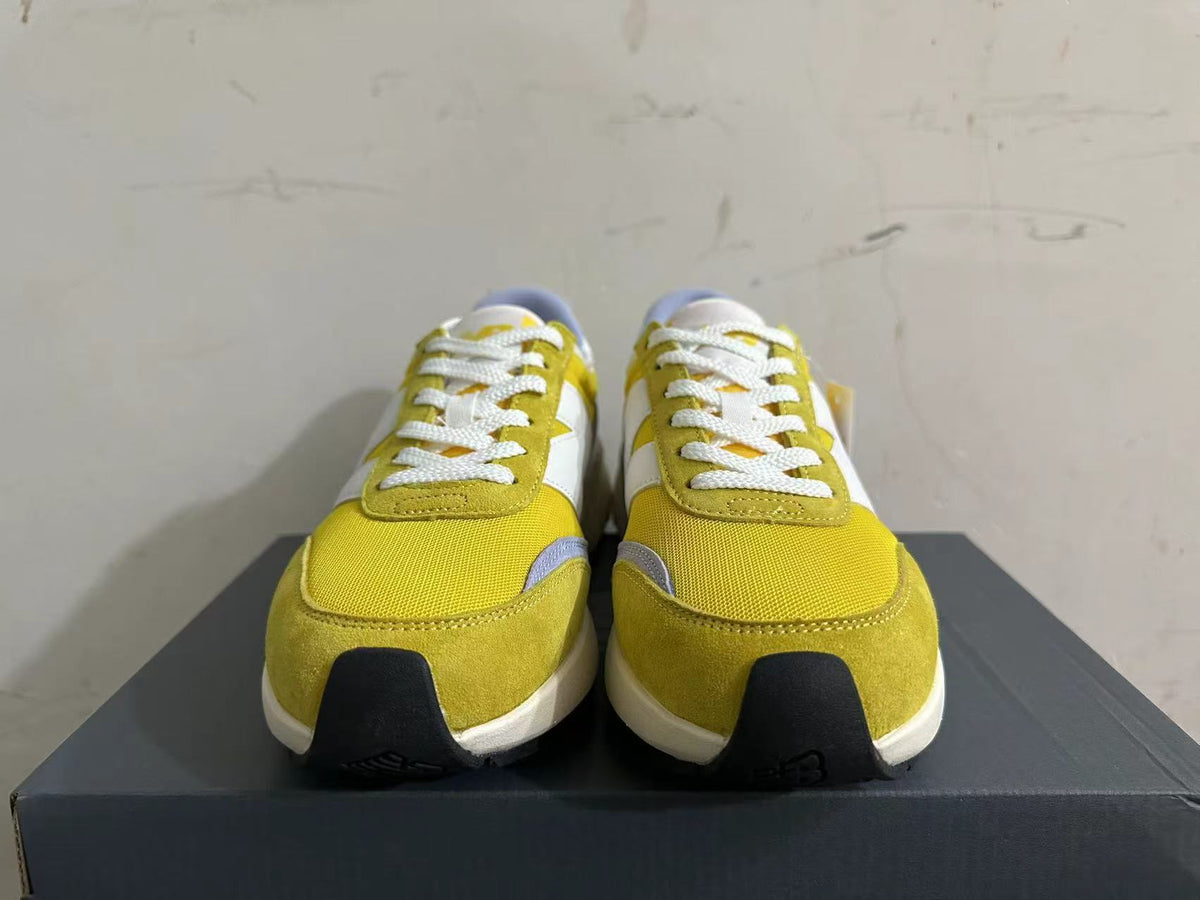 New Balance U370 Trainers in Yellow and Lavender - product image from the listing.